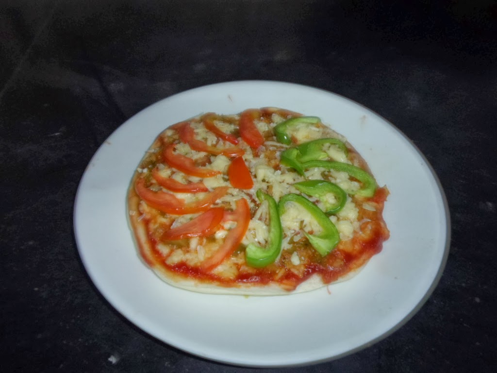 Cheese Pizza with Capsicum and Cabbage topping A make at home pizza recipe using cheese, capsicum and cabbage