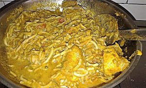 Noodles Being Cooked in Chicken Gravy